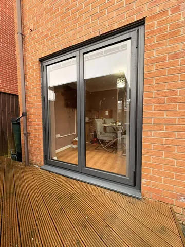 Anthracite grey bifolding doors installed on a Laceby home