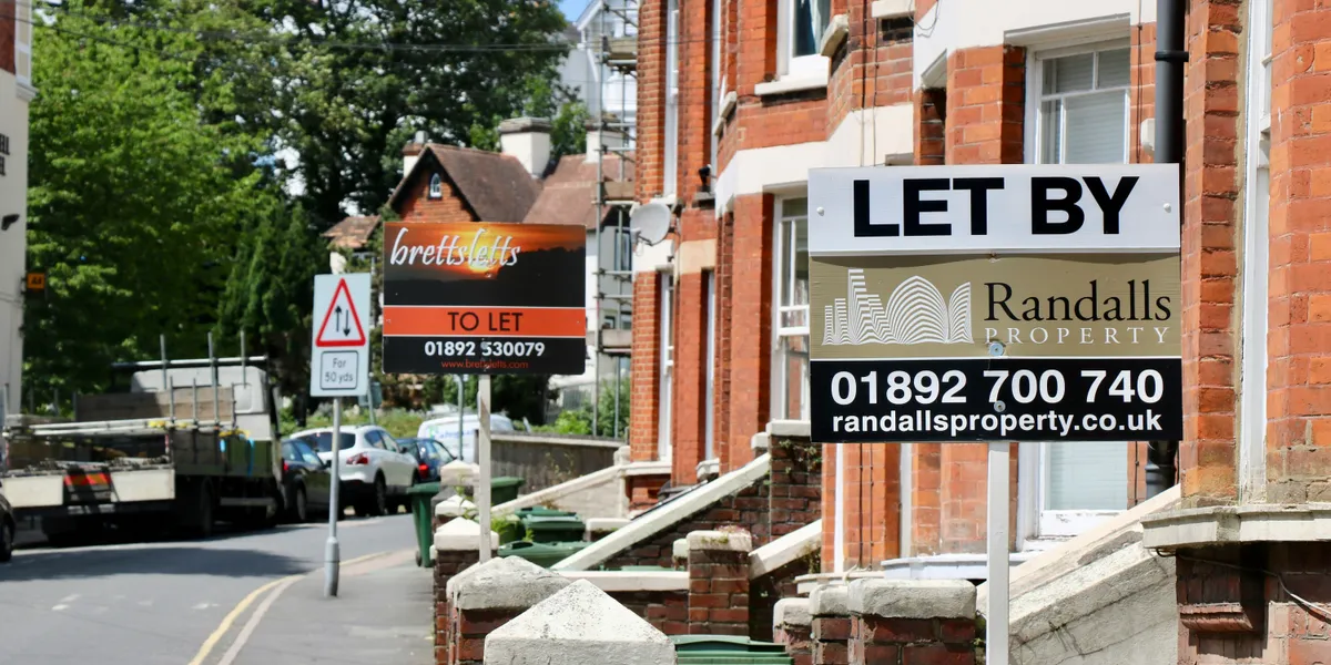 To Let and Let By signs outside terraced rental properties