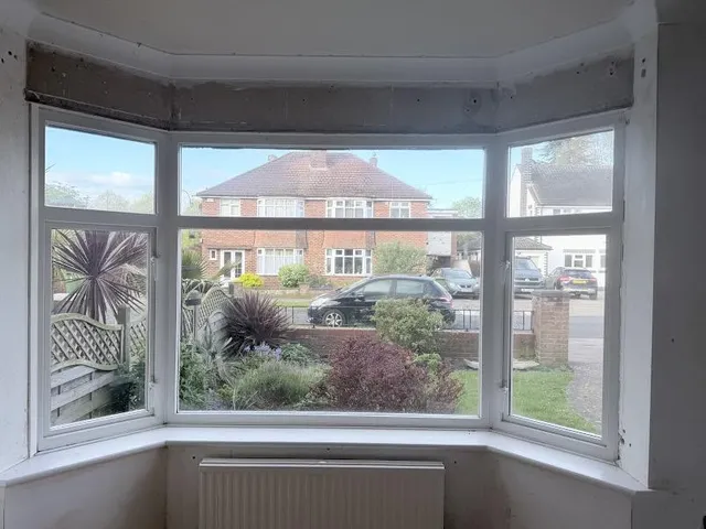 Front bay window before replacement, with old frames and no opening vents